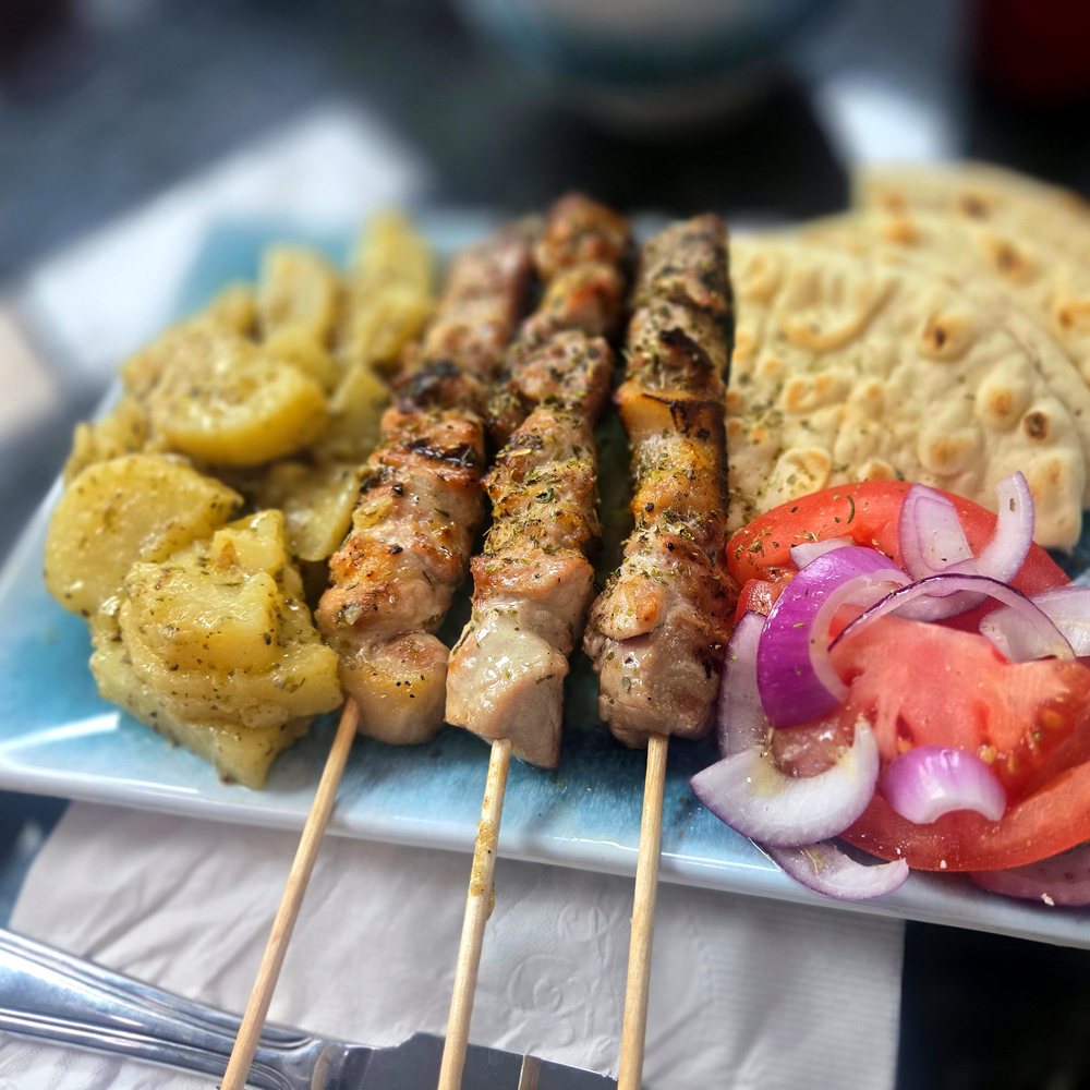 Souvlaki skewer plate with Greek lemon potatoes and pita